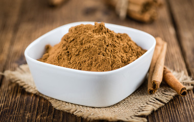 Wooden table with Cinnamon (selective focus)