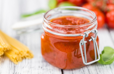 Tomato Sauce (selective focus) on vintage wooden background