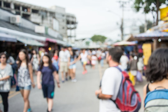 Blurred image of people walking at market