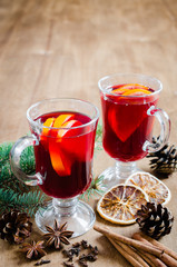 Christmas Mulled Wine and Spices on wooden background.