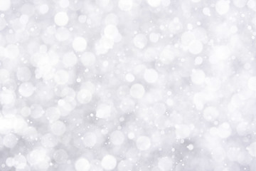 Abstract white bokeh with snowfall background