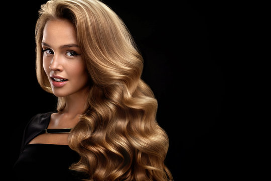 Beautiful Curly Hair. Female Beauty Model With Volume Hair