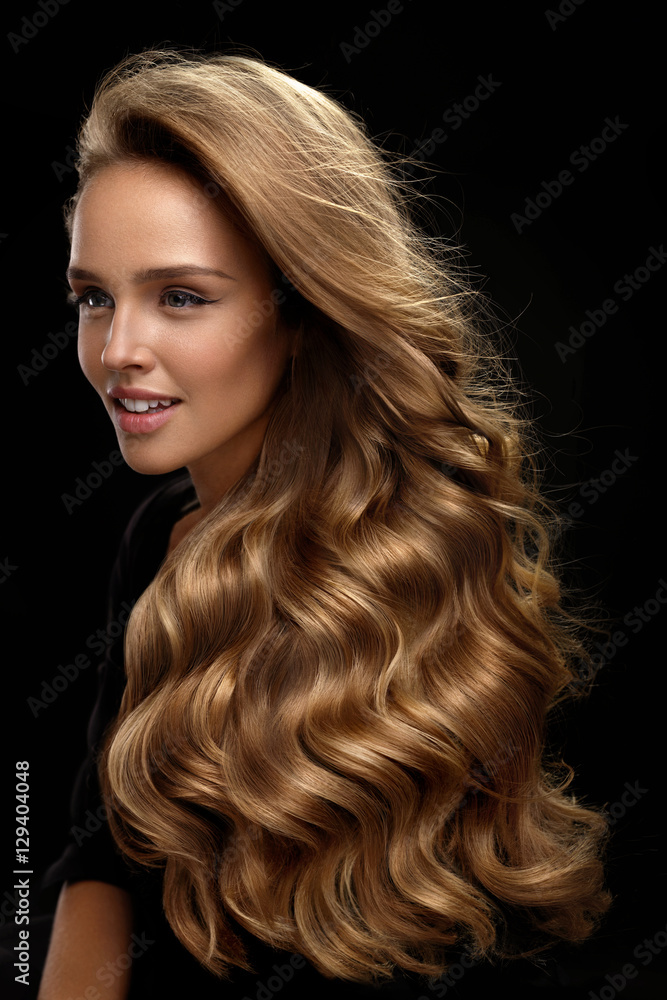 Wall mural beautiful long hair. woman model with blonde curly hair