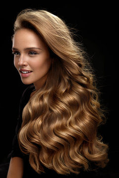 Beautiful Long Hair. Woman Model With Blonde Curly Hair