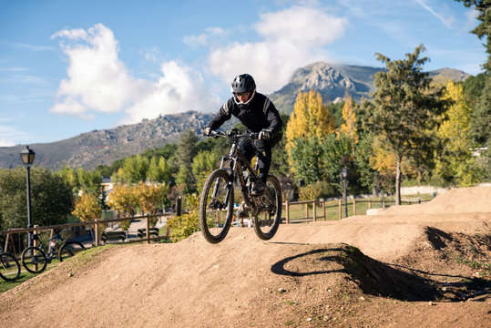 Extreme jump on a bike in forest