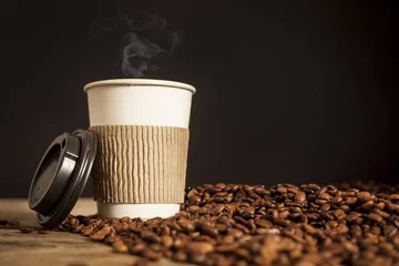 Fotobehang Paper cup of coffee on black background © sebra
