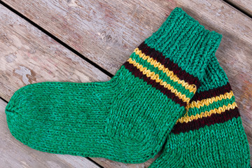 Cute green handmade knitted socks.