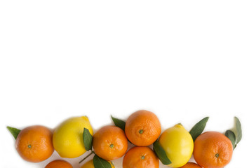 Mandarins and lemons. Fruits close-up on a white background. Top view with copy space.