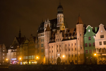 Obraz premium Famous medieval St. Mary's Gate in the historic city at night. Gdansk is a Polish city on the Baltic coast and popular center of tourism. 