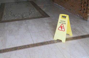 caution wet floor sign on floor