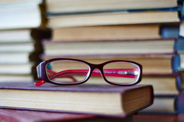 Composition with glasses and books