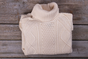 Knitted sweater with a beautiful ornament.