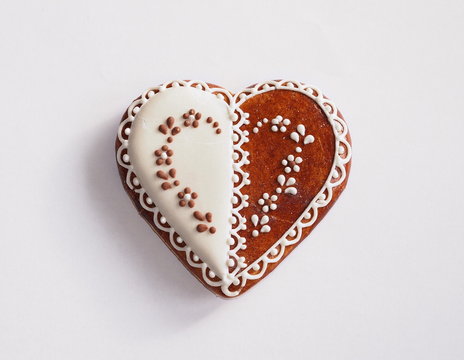 Heart shape gingerbread cookie on a white background.