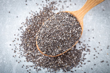 Chia seeds in a wooden spoon. Superfood, healthy concept