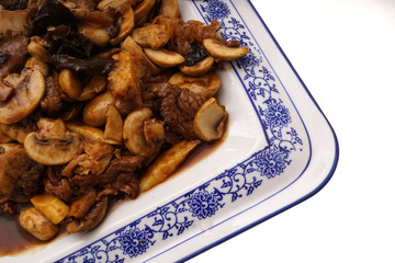 Veal with black and white mushrooms and bamboo shoots