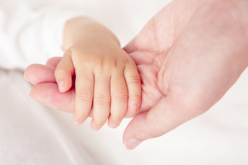 Soft focus and blurry of Baby Hands, vintage style color effect