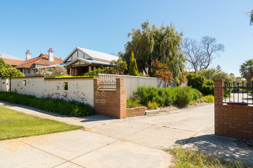 Path in garden with traditional houses in the background, Perth, Western Australia .