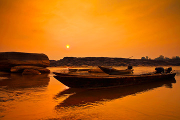 Sunrise fishing boat morning in mekong river. (sam pan bok) ubon ratchathani,Thailand.