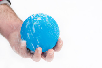 Christmas bauble in hand