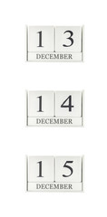 Closeup group of white wooden calendar with black 13 , 14 , 15 december  word , three date calendar isolated on white background