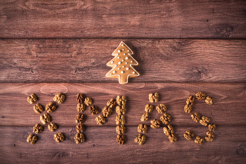 Wrote XMAS text with walnut on wooden