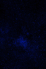 Freeze motion of blue dust explosion isolated on black backgroun