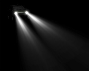 headlights beam of a car approaching in the dark