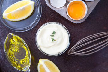 Fresh homemade white sauce Mayonnaise and ingredients eggs, lemo