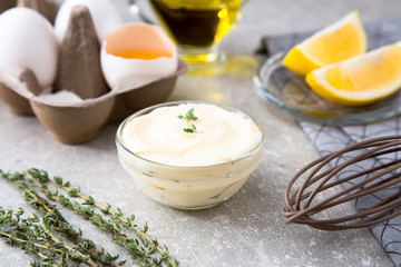 Fresh homemade white sauce Mayonnaise and ingredients eggs, lemo