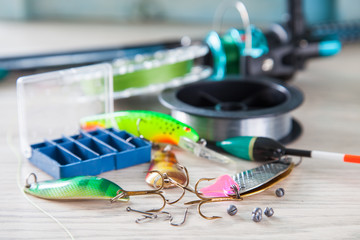 fishing tackle on a table. selective focus © murziknata