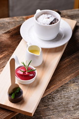 Hot Chocolate Souffle with vanilla sauce, raspberries sorbet