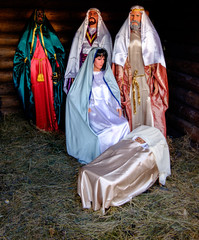 Christmas nativity scene with figures, including Jesus, Mary, Joseph and the Magi.