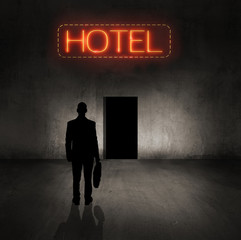 man walking into hotel - 129422669