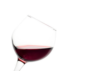 Slanted glass of red wine