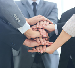Obraz premium Business team joining hands together
