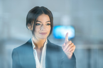The businesswoman touch the virtual screen
