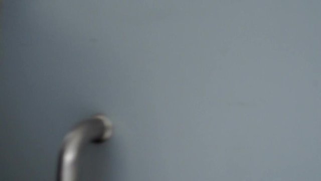 Male hand opens a door of a house using magnetic key