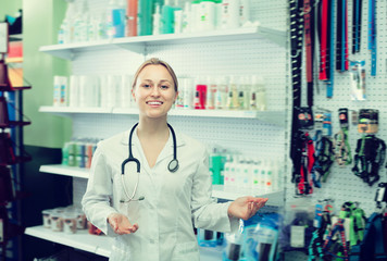 Glad woman vet recommending on goods for pets