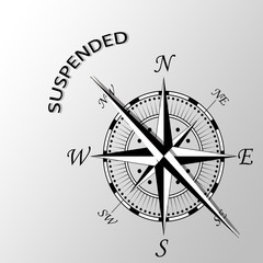Illustration of suspended word written aside compass