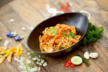 Spaghetti fried with sour prawn soup ,selective focus