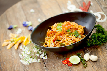 Spaghetti fried with sour prawn soup ,selective focus