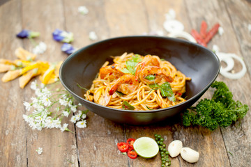 Spaghetti fried with sour prawn soup ,selective focus