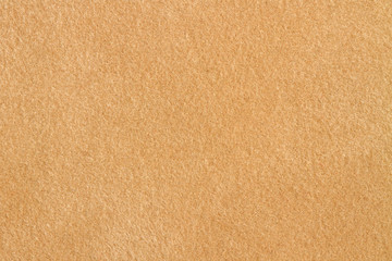 Beige velvet paper texture, dark background