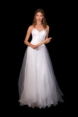 Fototapeta premium Beautiful bride in white dress isolated on black background.