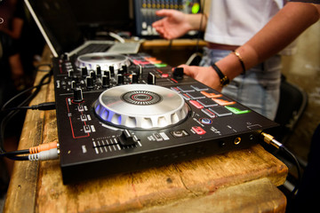 Obraz premium DJ works with panel during party