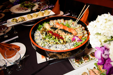 Round dish with different kinds of sushi