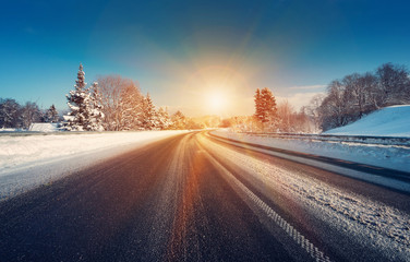 Asphalt road in snowy winter on beautiful frosty sunny day - Powered by Adobe