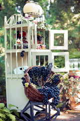 Candy bar and basket with grape - sweet place on holiday