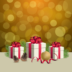 Glowing golden bokeh background and christmas gift boxes with decoration balls