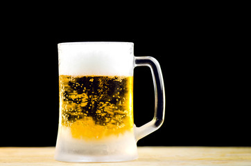 Ice Cold Mug Of  Beer On Black Background